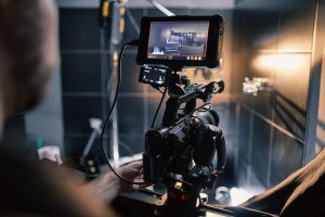 Behind the scenes of filming films or video products and the film crew of the film crew on the set in the pavilion of the film studio. Video Production Concept